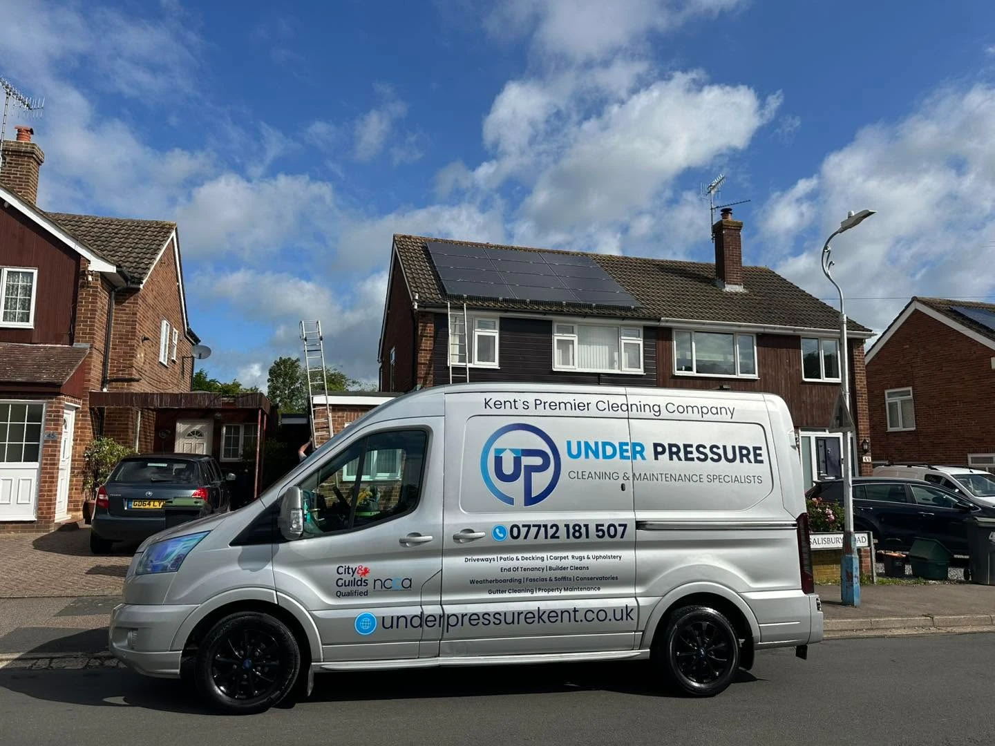 Under Pressure van outside a house.