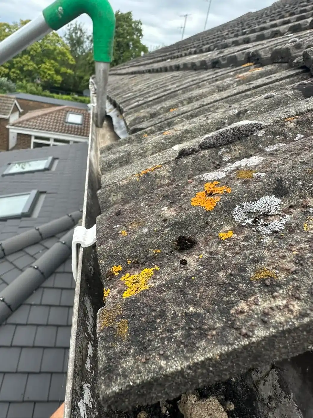 Clearing out a gutter.