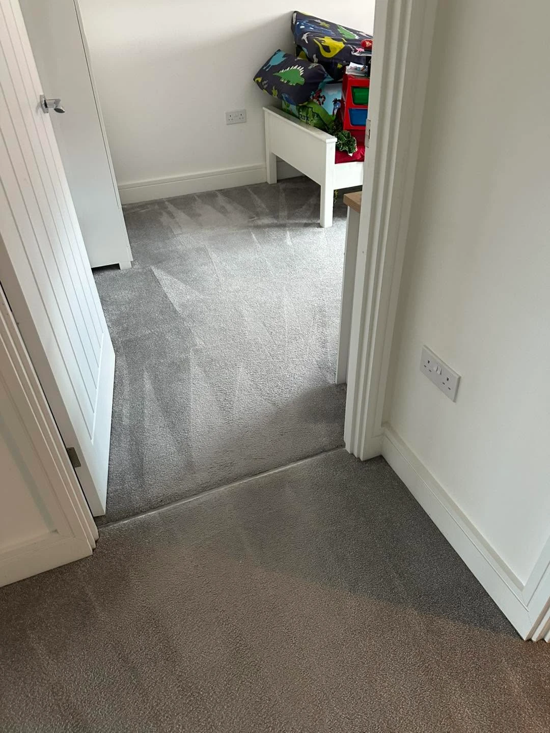 Carpet in the bedroom and on the landing being cleaned.