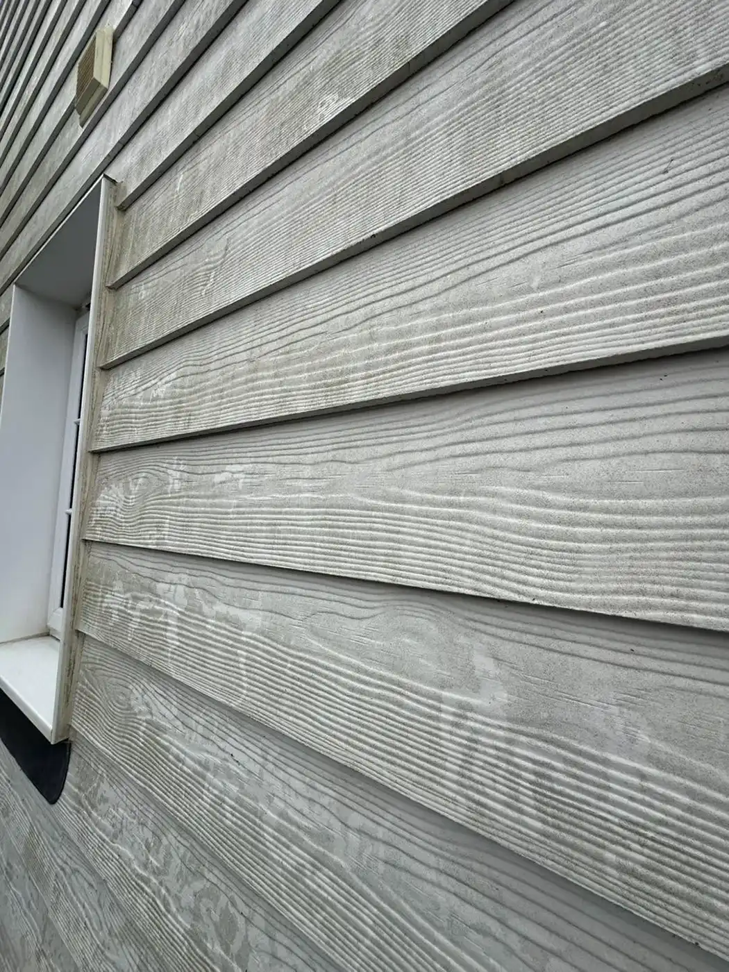 Close up of house with slatted panels.