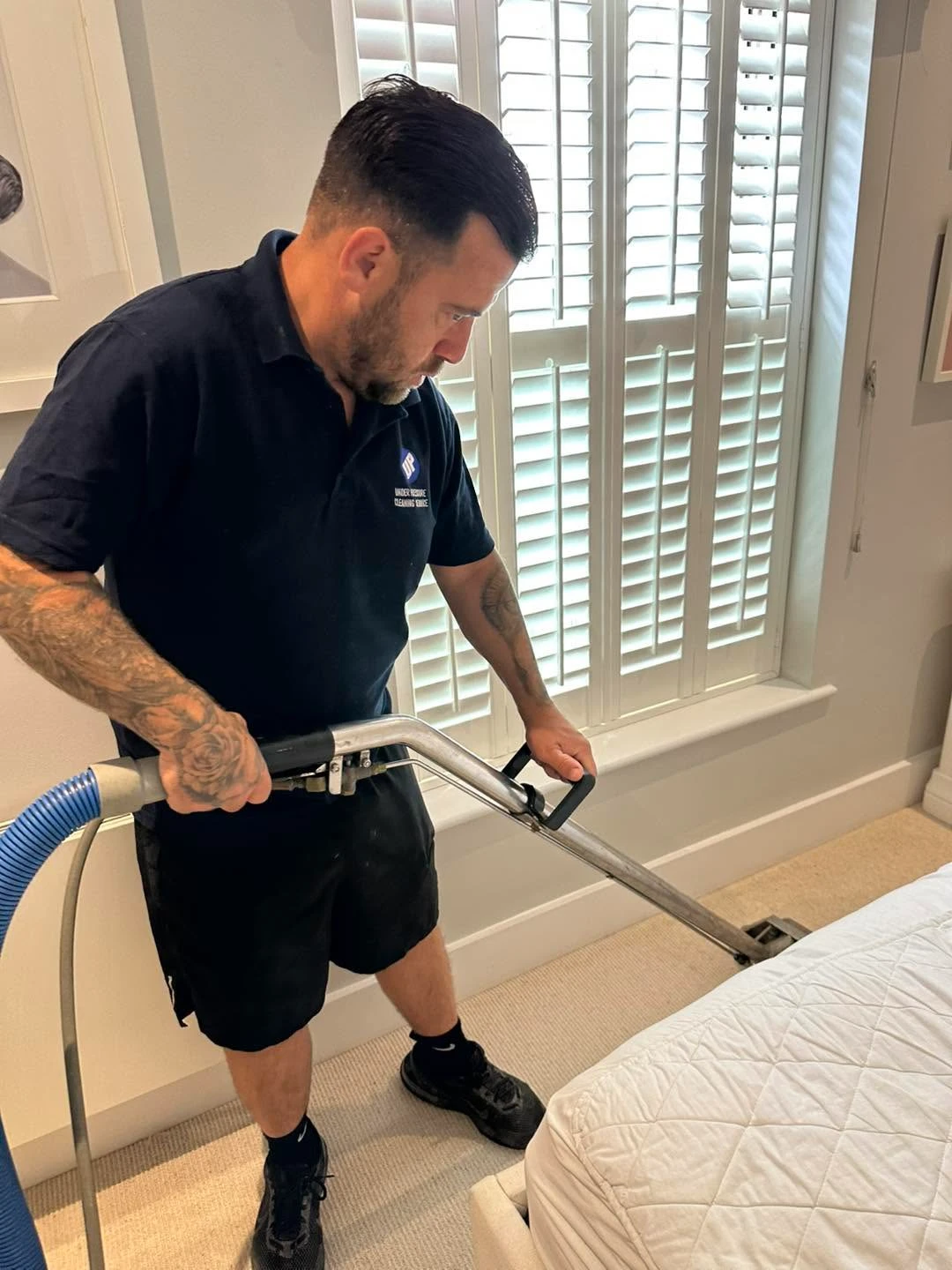 Man cleaning a carpet.