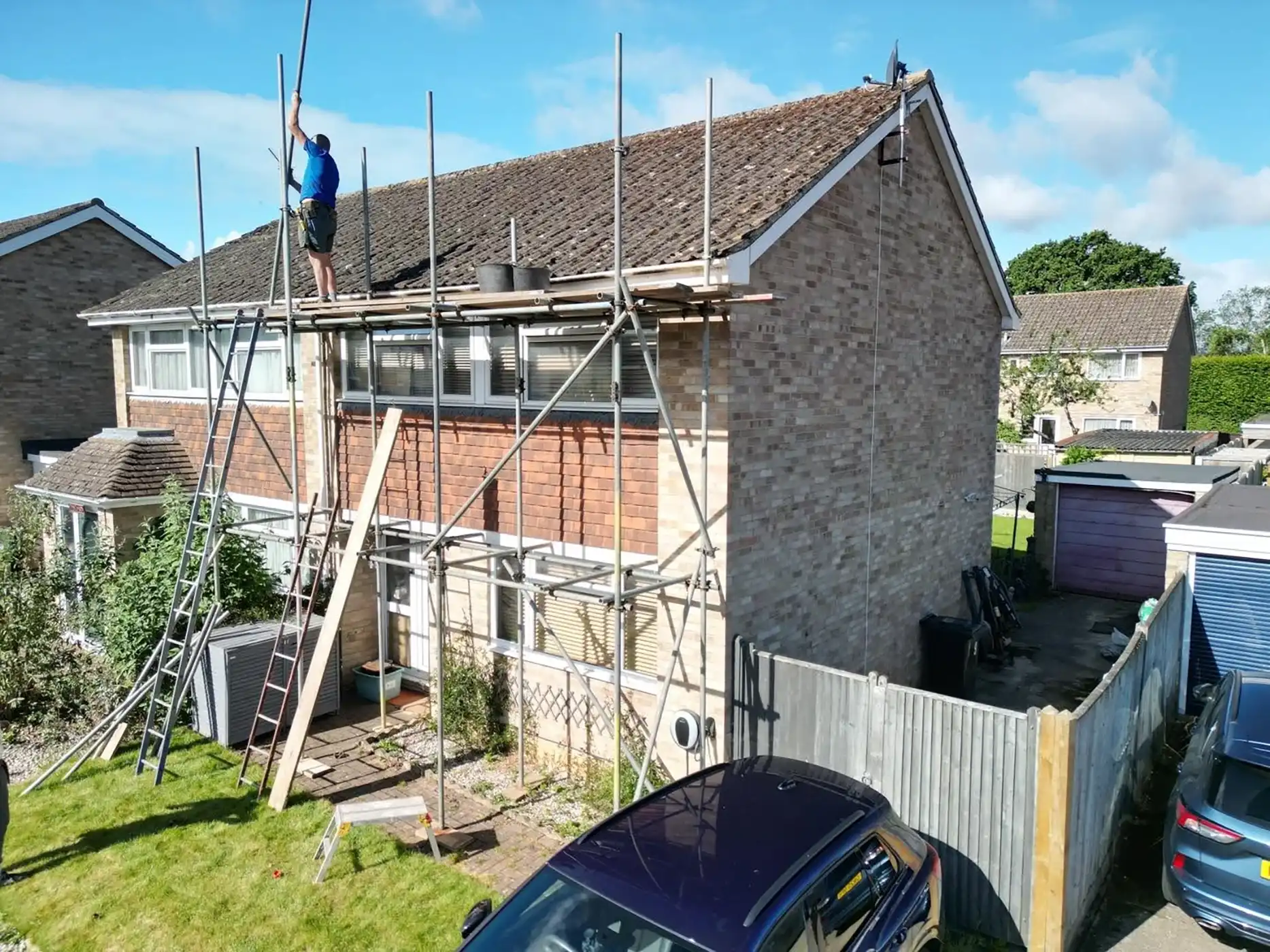 Scaffolding on the outside of a house.